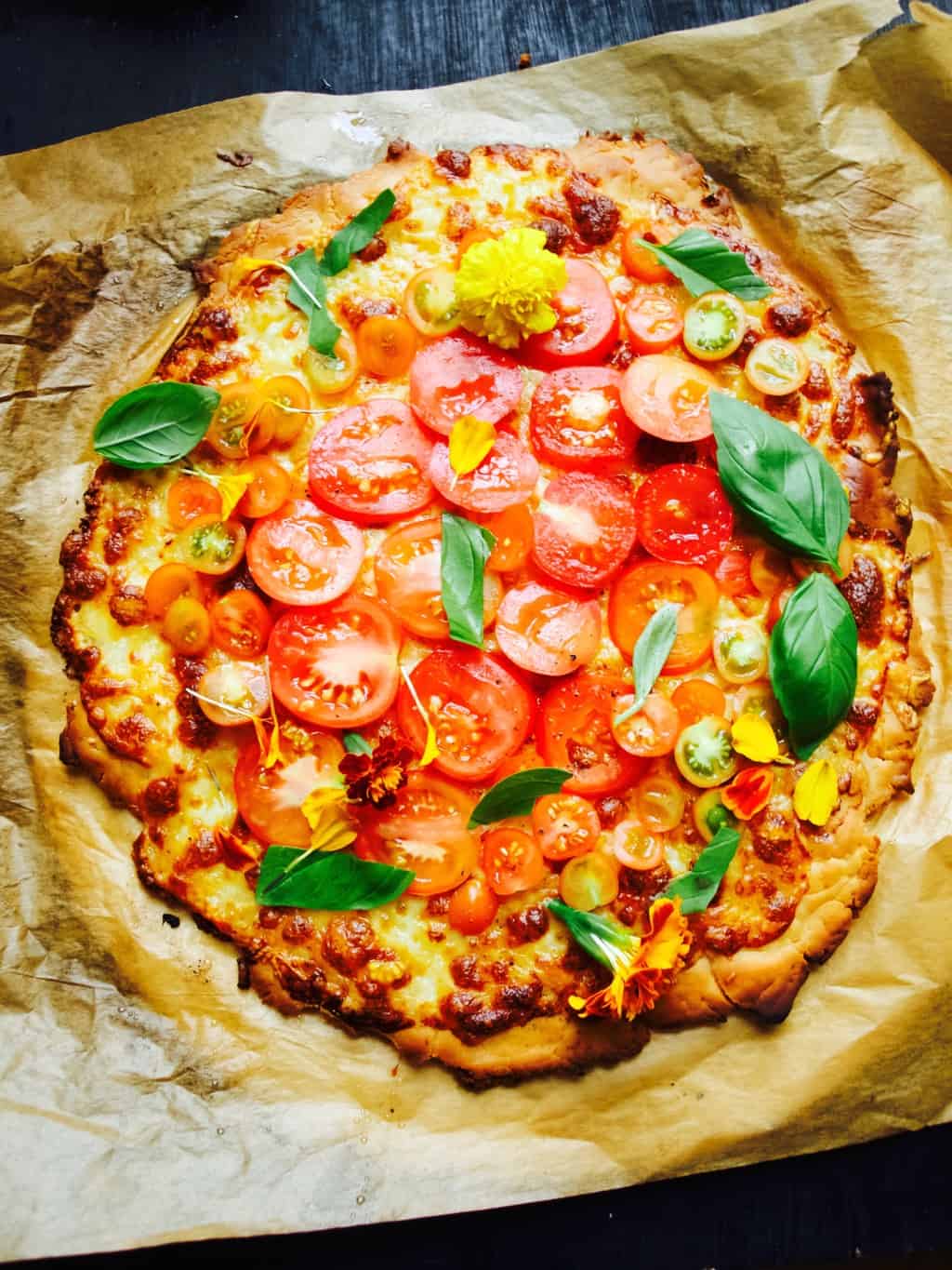 Gluten free pizza topped with fresh ingredients